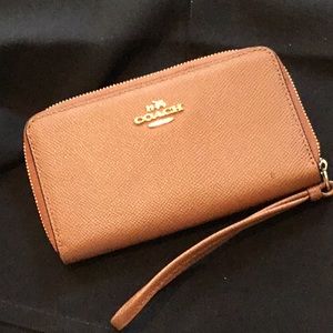 Light brown COACH wristlet
